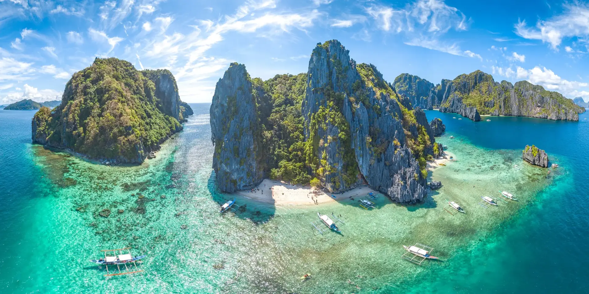 Aerial view of El Nido's limestone islands, white beaches and turquoise shallows